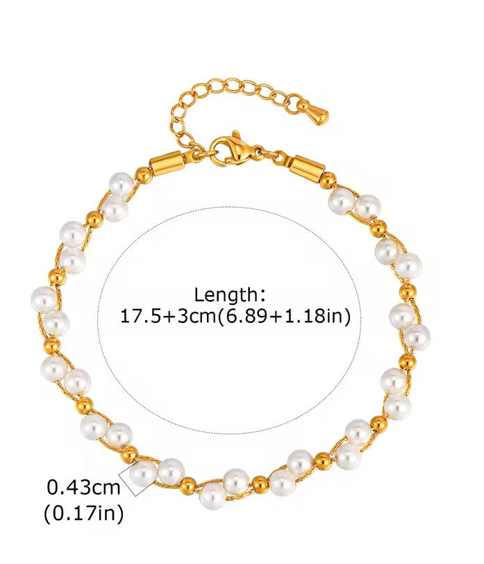 Gold and pearl bracelet with measurement details on a white background