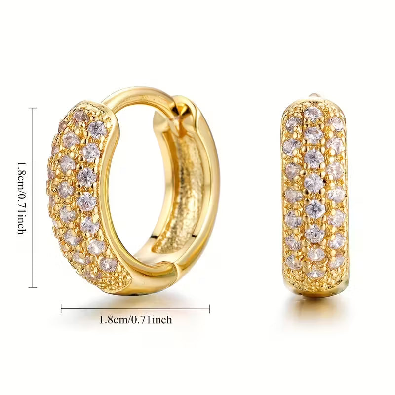 Gold hoop earrings with diamond accents and measurements on a white background