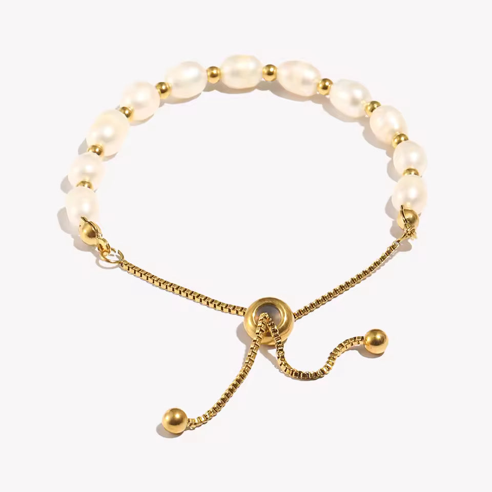 Gold and Pearl adjustable bracelet on clear stand