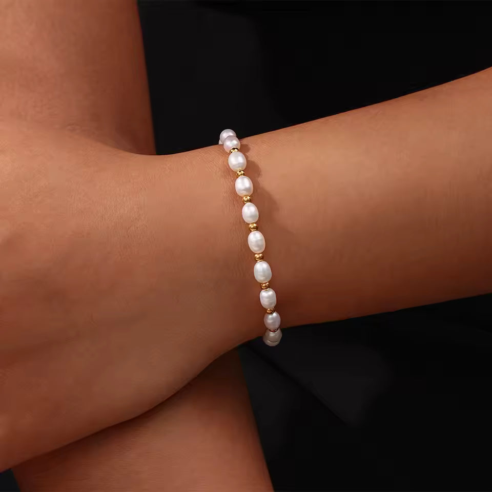 Gold and Pearl Adjustable Bracelet worn by person