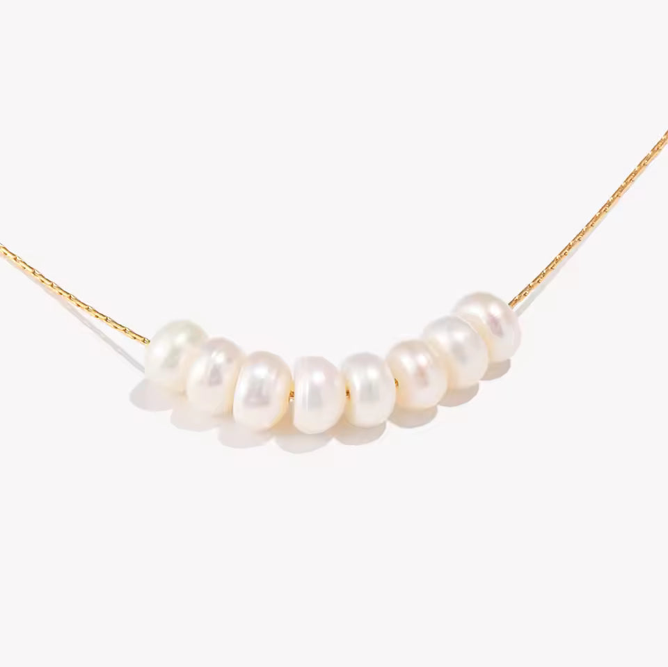 Pearl necklace on a white background