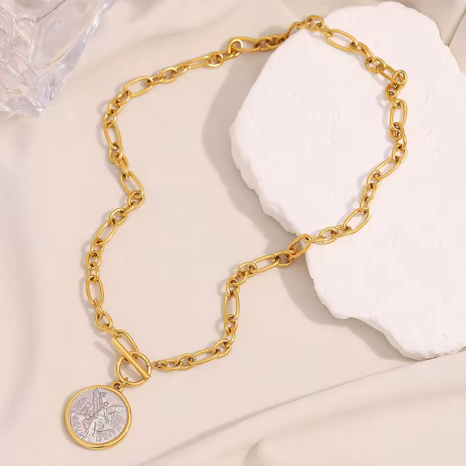 Gold Coin Necklace on cloth