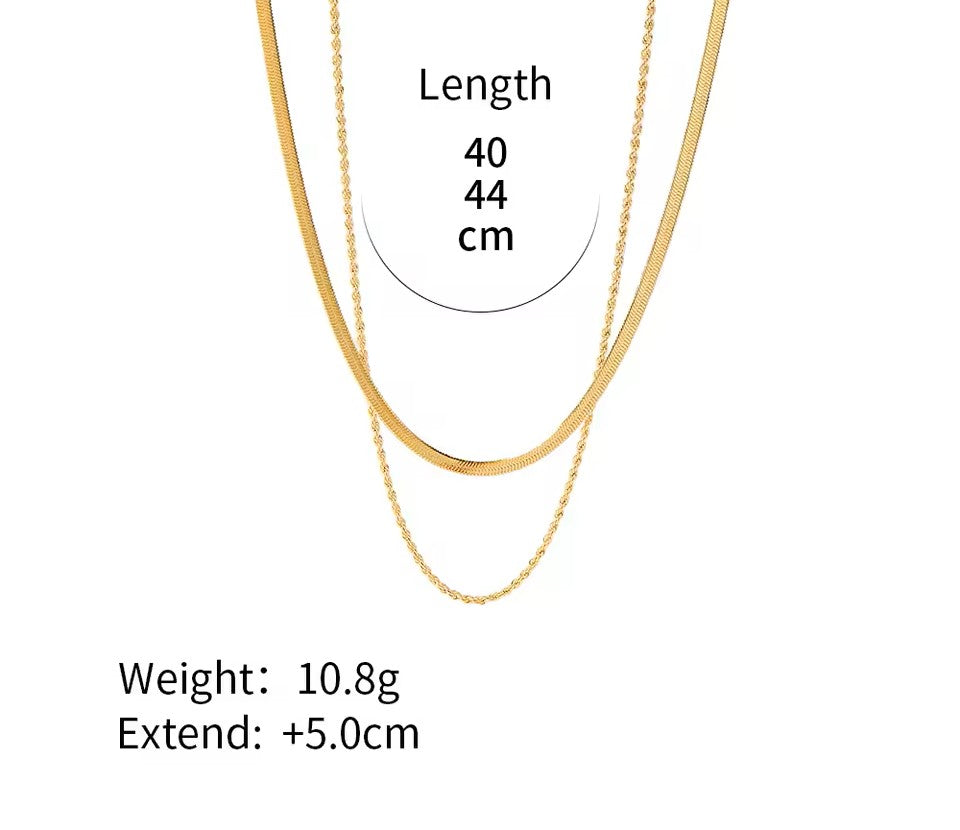 Gold chain with measurements on a white background