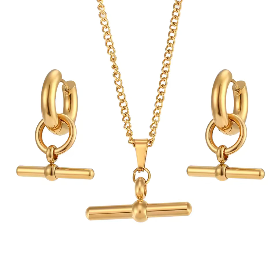 Gold jewelry set with necklace and earrings on a white background