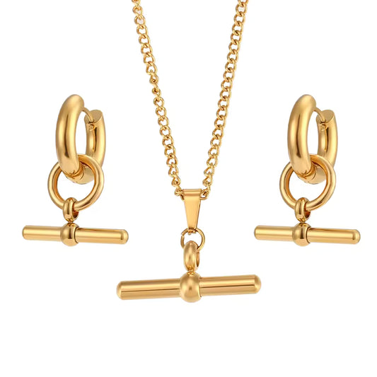 Gold jewelry set with necklace and earrings on a white background