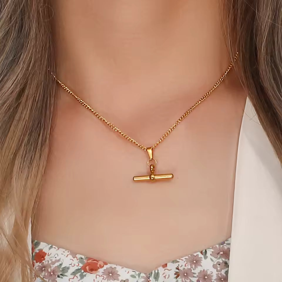 Gold T Bar Necklace worn by a person