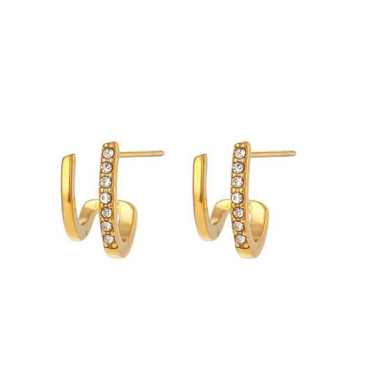 Gold hoop earrings with embedded stones on a white background