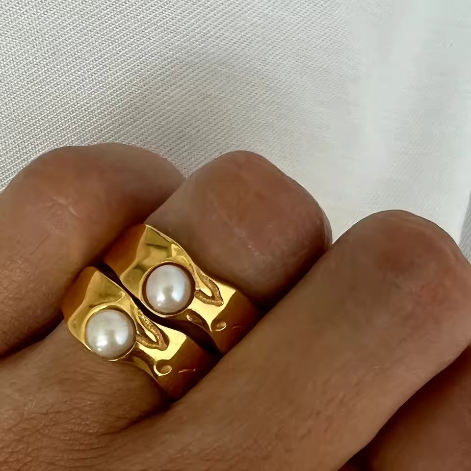 Double Pearl Gold rings on hand