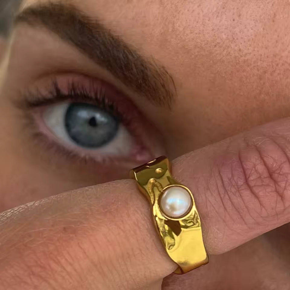 Pearl Gold Ring worn by a woman