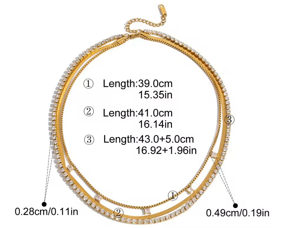 Gold necklace with measurement details on a white background