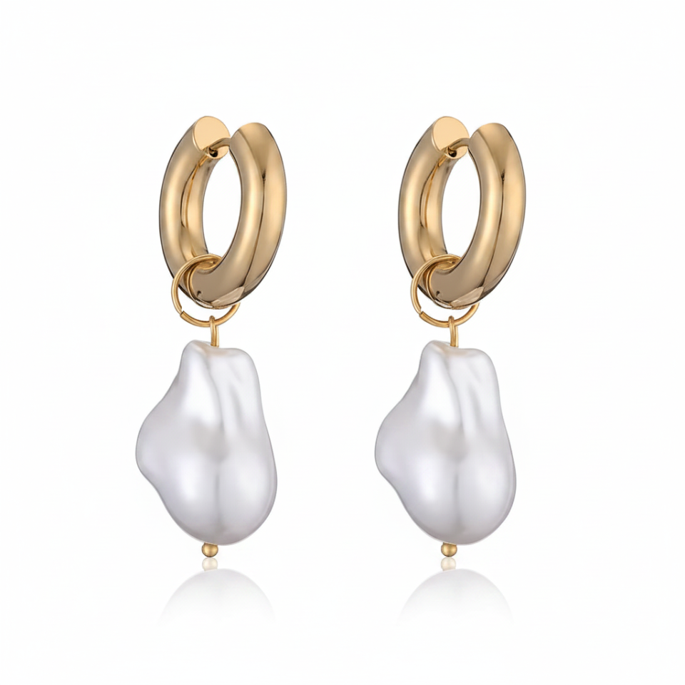 Gold hoop earrings with white baroque pearl drops on a white background