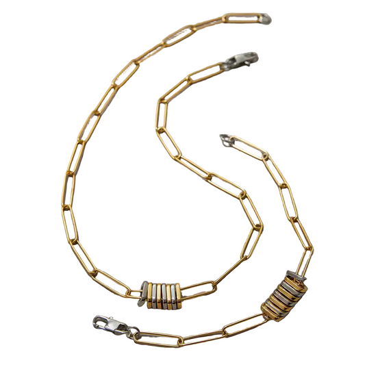Gold chain with metal clasp on a white background