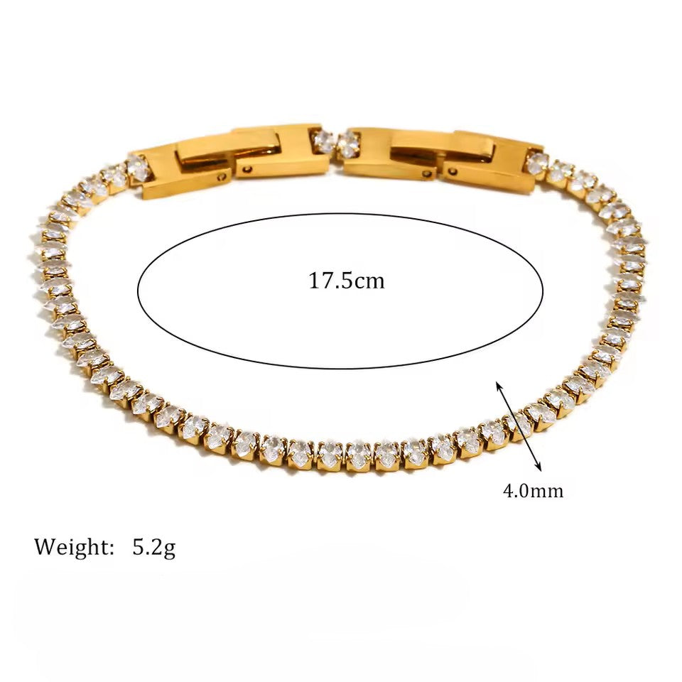 Gold bracelet with diamond accents, shown with measurements on a white background