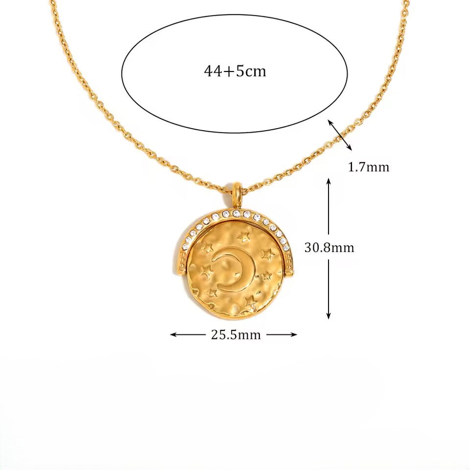 Gold necklace with a pendant, showing measurements on a white background