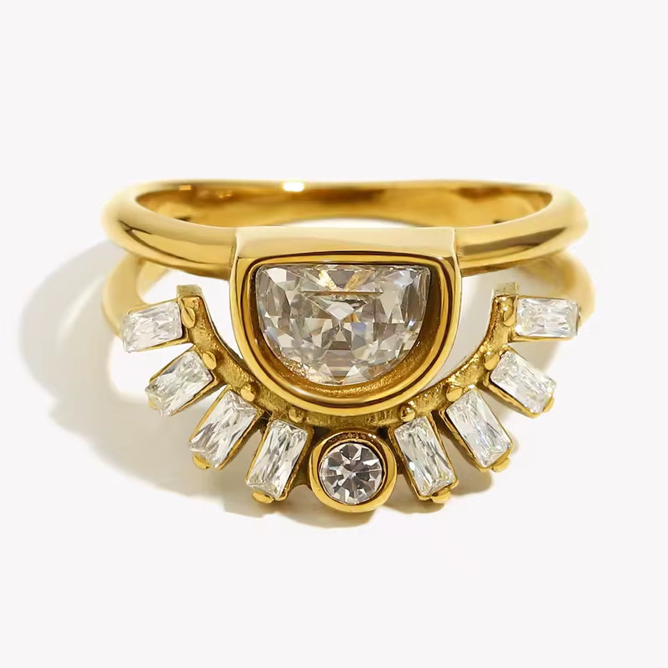Gold ring with a large central diamond and smaller diamonds on a white background