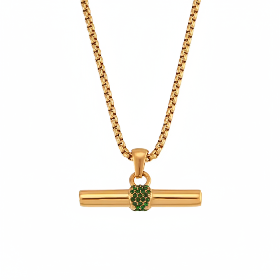Gold necklace with a green gemstone pendant on a white background