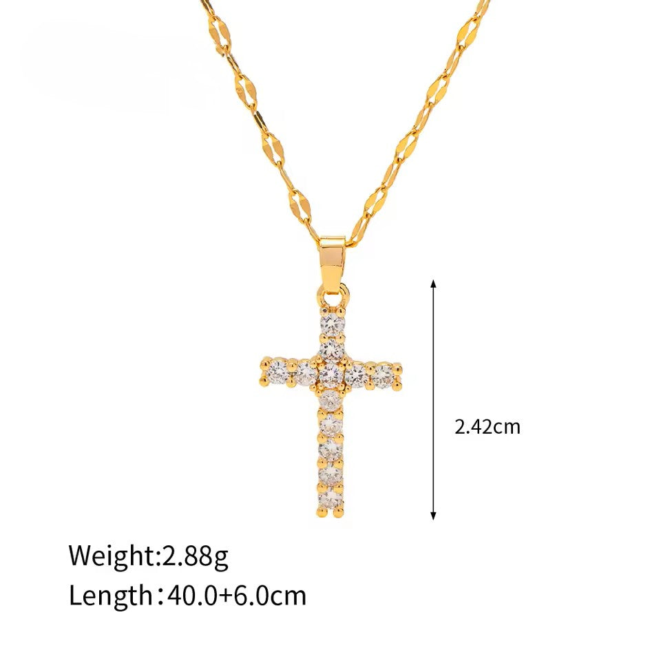 Gold cross necklace with chain on a white background