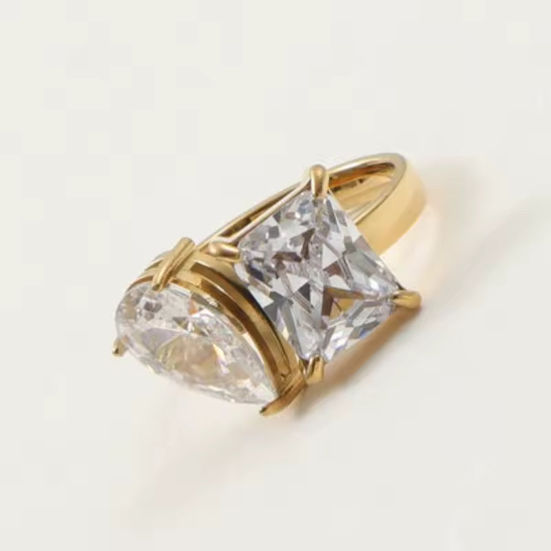 Ring with two cubic zirconia's on white background