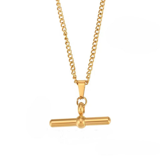 Gold necklace with a unique pendant on a white background