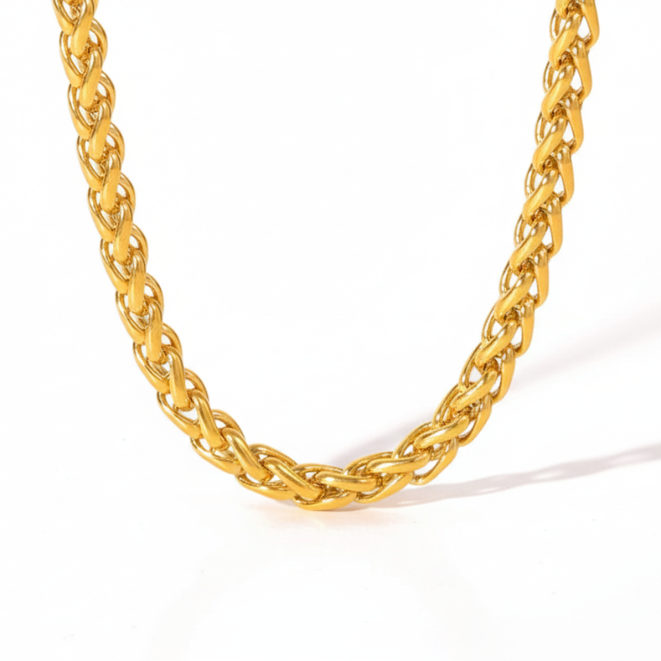 Gold chain necklace on a white background