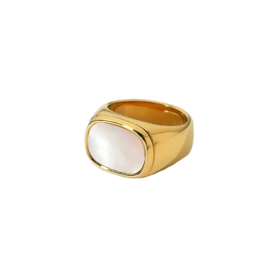 Gold ring with a white stone on a white background