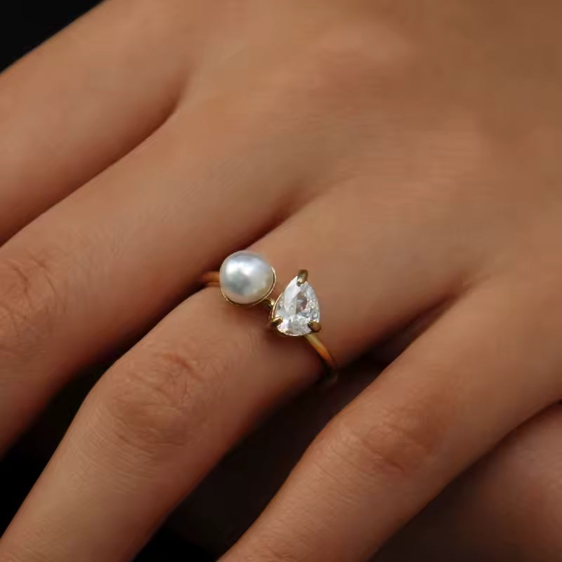 Ring with pearl and diamond setting worn on hand