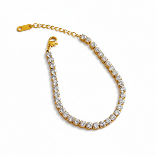 Gold bracelet with clear stones on a white background