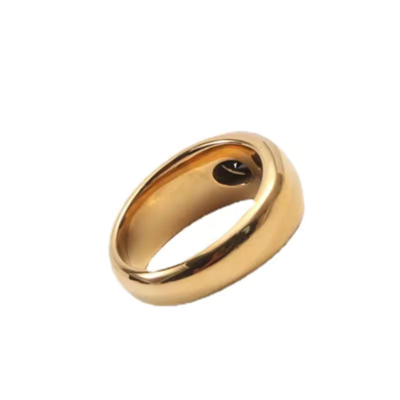 Gold ring on a white background
