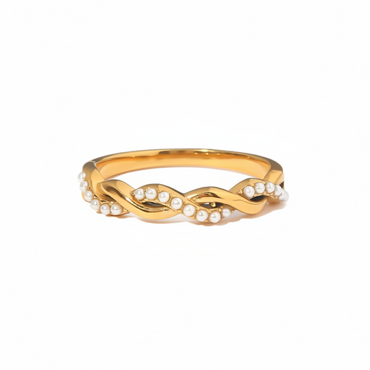 Gold ring with pearls on a white background