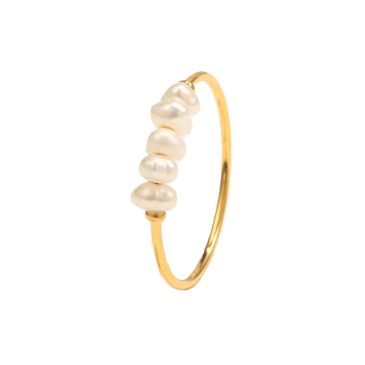 Gold bracelet with pearls on a white background