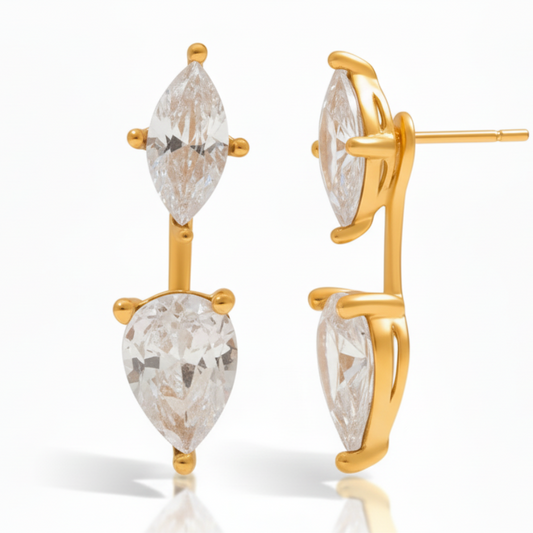 Gold earrings with clear gemstones on a white background