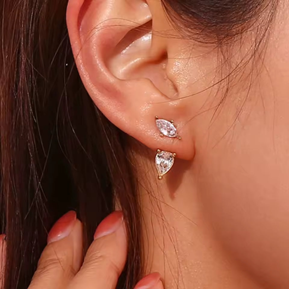 Zircon teardrop earrings worn on brunette