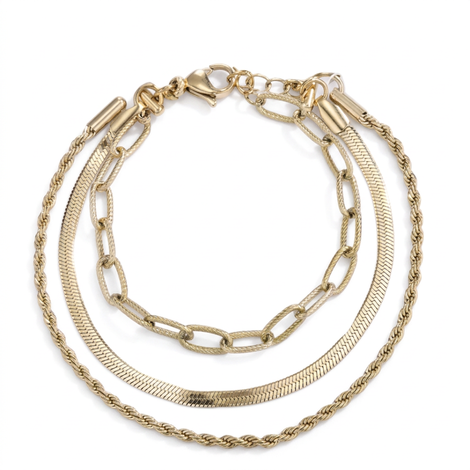A gold-toned multi-strand chain bracelet featuring three distinct chain styles: a textured snake chain, a classic link chain, and a twisted rope chain, all arranged on a plain white background.